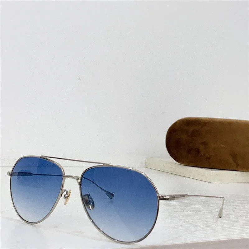 Aviator sunglasses with blue gradient lenses and silver frame, displayed beside a brown case.
