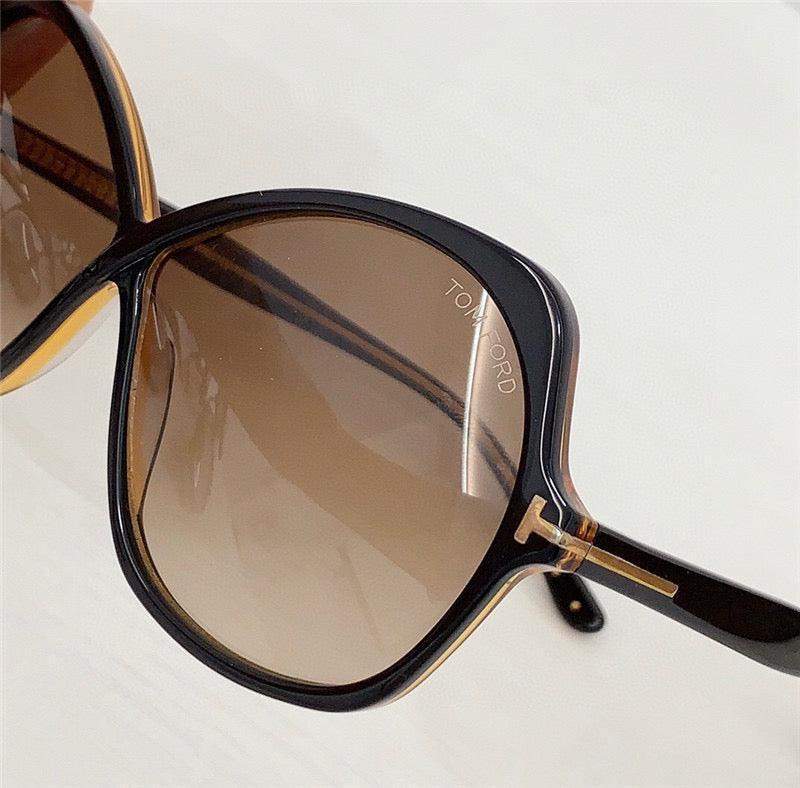 Brown gradient oversized sunglasses with black and gold frame, Tom Ford logo on lens