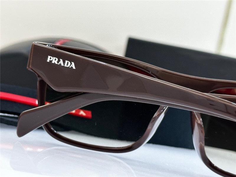 Brown Prada sunglasses with thick arms and logo, luxury eyewear close-up on table