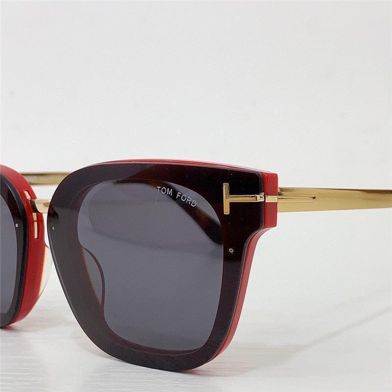 Square red sunglasses with gold metal arms and dark lenses, luxury eyewear closeup