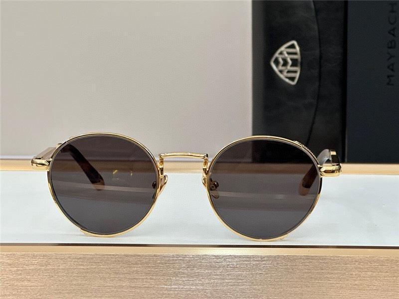 Round sunglasses with gold metal frame and dark polarized lenses on display