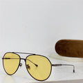 Aviator sunglasses with yellow polarized lenses and thin black frame on white surface