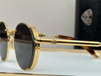 Gold round sunglasses with black lenses and textured frames, luxury polarized eyewear