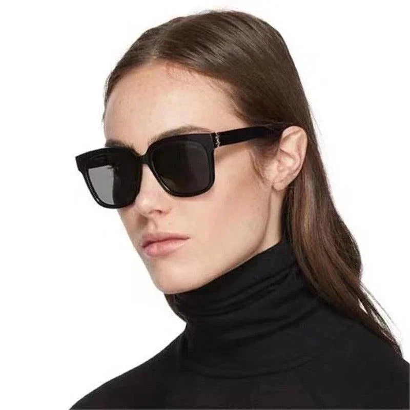 Woman wearing black square polarized sunglasses with UV400 protection and stylish frames