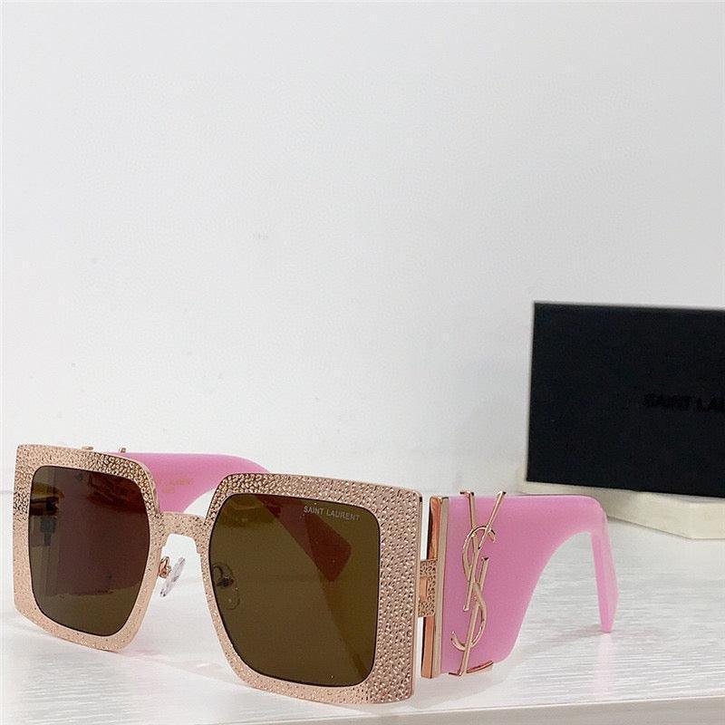Square oversized sunglasses with rhinestone rims, pink arms, and gold YSL logo accent