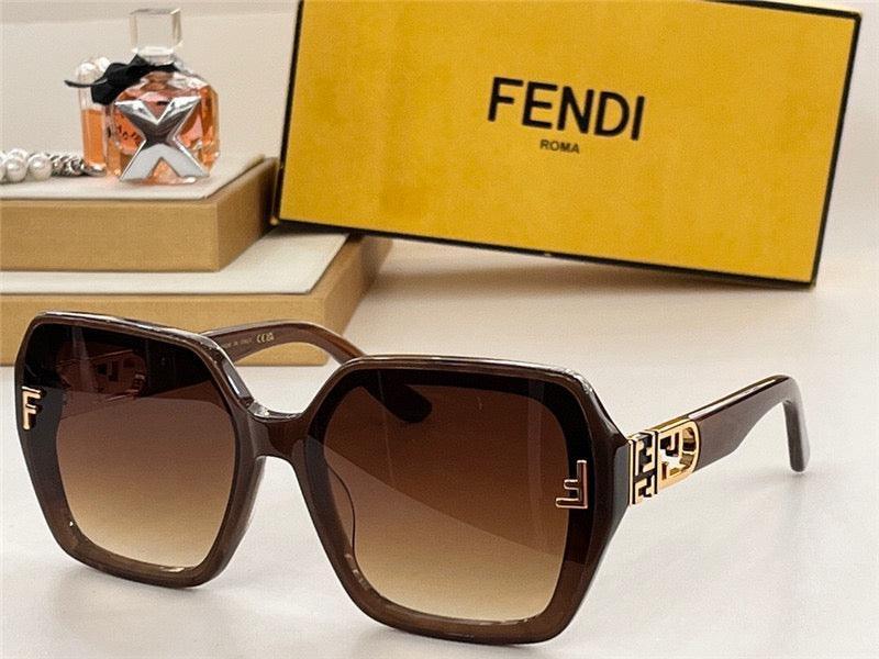 Brown oversized Fendi sunglasses with gold accents, gradient lenses, and branded case