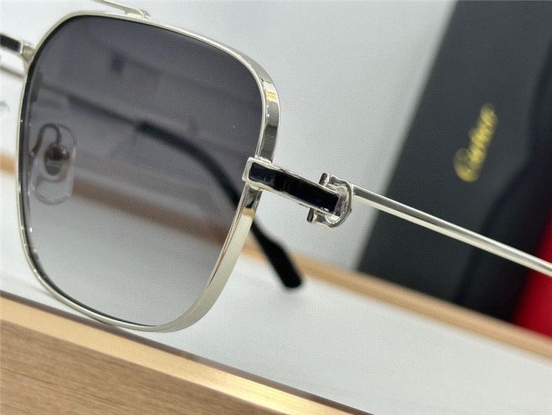 Close-up of luxury square sunglasses with silver metal frame and gradient lenses