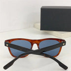 Tortoiseshell frame sunglasses with blue polarized lenses and black arms on white surface